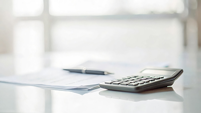 financial papers and calculator